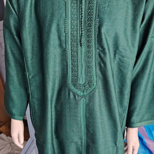 Real close photograph of the chest embroidery on the Emerald Moroccan thobe, showing the tone on tone stitching.