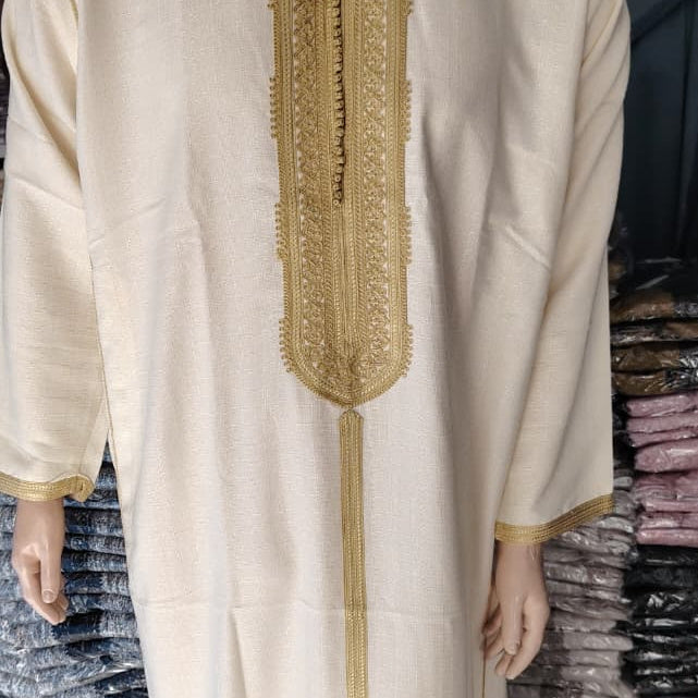 Real close photograph of the gold placket embroidery and sfifa braid on the Ivory and Gold Moroccan thobe.
